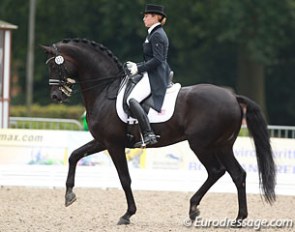 German based American Jennifer Hoffmann on her young Grand Prix horse Rubinio
