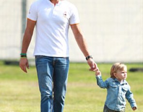 Spanish Grand Prix rider Jordi Domingo taking his son for a stroll