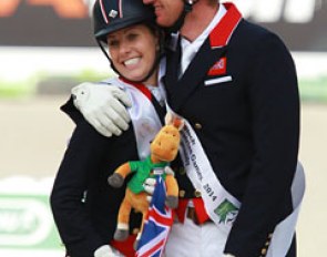 Charlotte Dujardin gets a hug from Gareth Hughes before mounting the podium