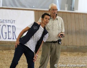 Dr. Kerry Ridgway "using" his wife Christine to demonstrat​e laterality​​ during his lecture