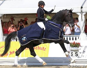 Dorothee Schneider and Sezuan win the 6-year old finals at the 2015 World Young Horse Championships :: Photo © LL-foto
