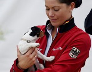 Kristina Sprehe cuddling a puppy