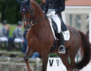 American Arlene Page's Woodstock struggled a bit with the piaffes today but scored points in the tempi changes 