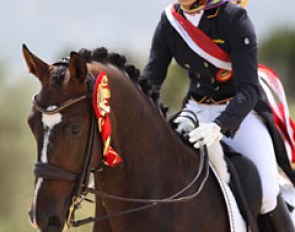 Hannah Erbe gives Carlos a big pat during the victory lap