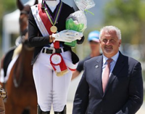 Anna Guseynova flanked by the judge at C, Juan Carlos Campos, at the 2016 European Children Championship