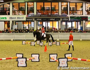 Cavaletti work for the talented Captain Veterano with the former Klimke apprentice Sophie Leube was a part of the demonstrations held at the 2016 Ingrd Klimke Symposium in Munster-Handorf :: Photo © Silke Rottermann