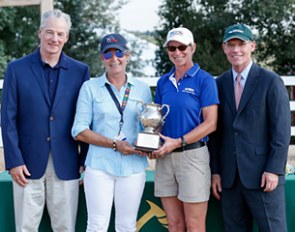 Stephan Hienzsch and Roberta Williams present the Patsy Albers Perpetual Trophy to Joan Clay, who is flanked by USEF ceo William Moroney :: Photo © Sue Stickle