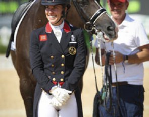 Golden girl Charlotte Dujardin, groom Alan Davies holding Valegro