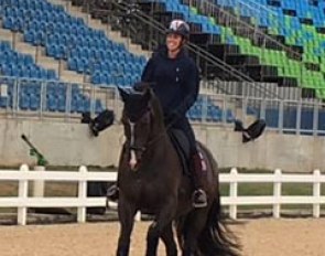 Charlotte Dujardin and Valegro in a snaffle taking a relaxed canter around the show ring