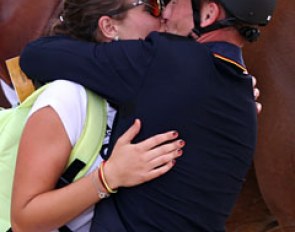 Michael Jung locking lips with his girlfriend after winning eventing gold