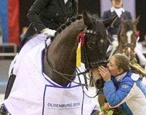 Mister X's groom giving him kisses during the prize giving ceremony