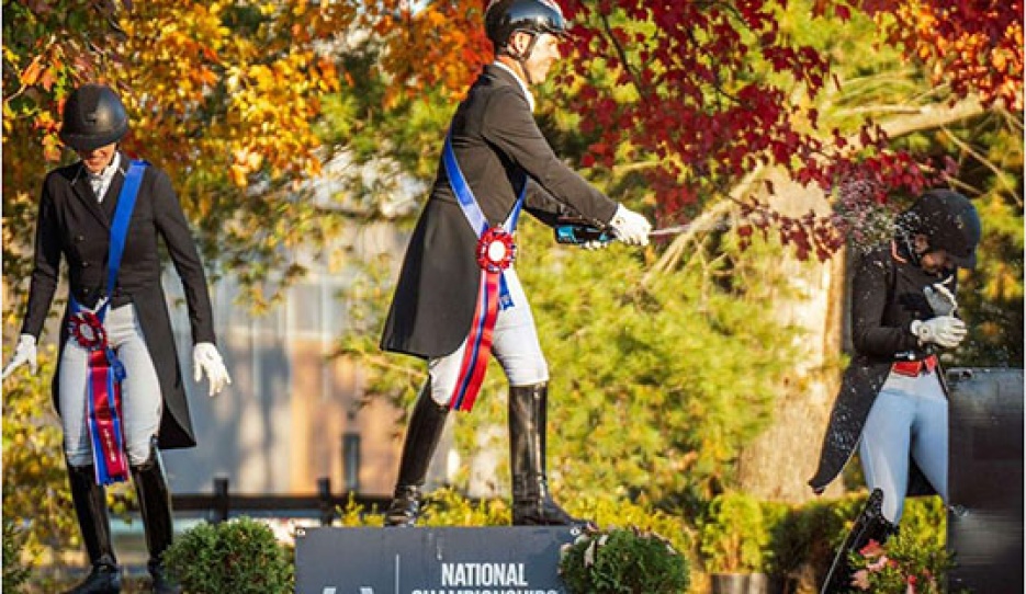 Jaimey Irwin leads the celebration on the FEI Medium Tour Open podium at the 2025 East Canada Dressage Championships :: Photo © Mousse Photographie