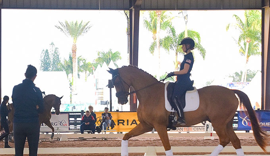 Olivia Lagoy-Weltz coaching a young rider in a clinic in Wellington :: Photo © Carmen Franco