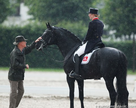 Wilfried and Laura Bechtolsheimer discuss her ride on Capri Sonne in the drizzle