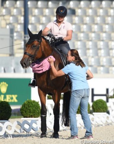 Werth's long time groom Steffi Weigard takes care of Emilio