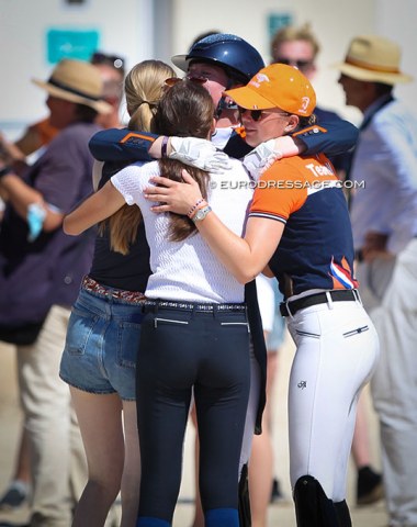 The silver medal winning Dutch team huddles together