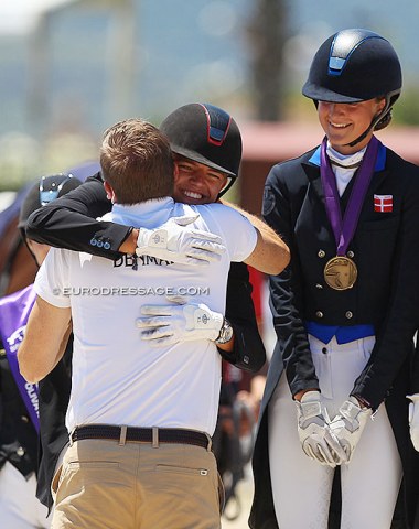Title sponsor Andreas Helgstrand hugs his son Alexander on the podium