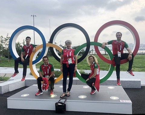 The Portuguese team with team trainer Kyra Kyrklund (who is attending her 11th Olympics!) in the Olympic rings at the Olympic Village for athletes