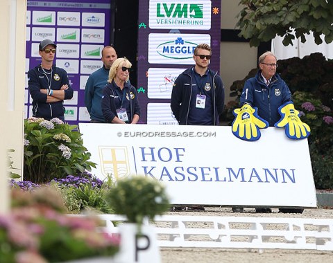 Swedish trainer Louise Natthorst and team captain Bo Jena with his patriotic gloves