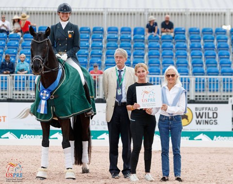 Paula Matute Guimon on Delagronge with Austrian judge Thomas Lang,  flanked by USPRE Week class sponsor Janne Rumbough (far right), the former president of the USPRE association. 