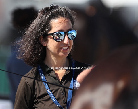 Dr. Shabe Chase at work at the horse inspection. The reflection in her glasses shows Jan Ebeling handing his horse's passport to her