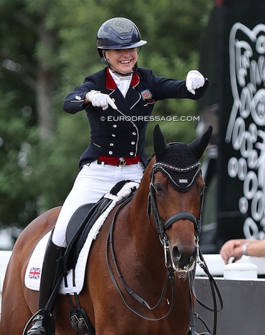 Jessica McConkey pointing with the "Anky finger" to credit her horse for the success