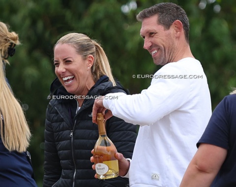 Celebrating silver with Ruinart Blanc de Blanc, a friend of coach Charlotte Dujardin pops the bottle