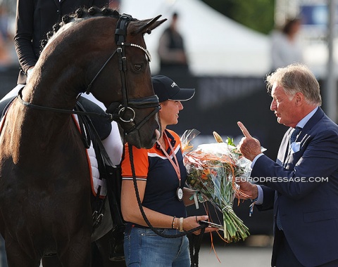 Jill Bogers' mom Harmke Koelman is the groom and talking to Frank Kemperman (for chair of the FEI Dressage Committee and CHIO Aachen show director), whose son Joris is now the Ermelo show director