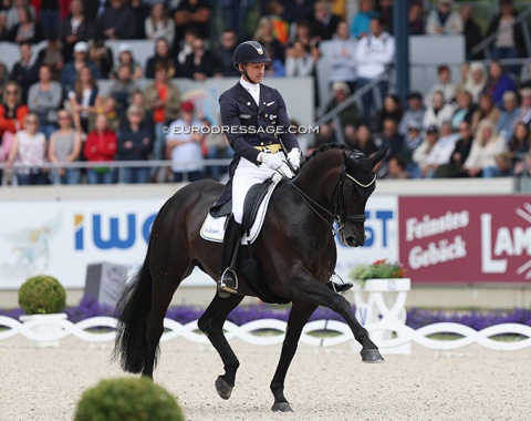 Patrik Kittel and Forever Young HRH performed to Stevie Wonder hits. Lots of passage work in this choreography and little true trot work. Very nice one tempi changes on a curved line. The piaffes lack sit behind and lift in front.