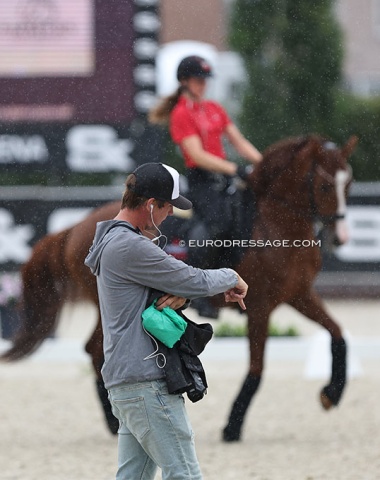 Former Danish youth team trainer Dennis Fisker giving instructions to his pony student who's riding in the rain