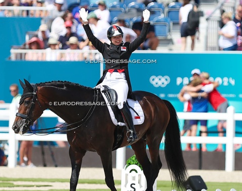 Chew waves to the crowd while her team hugs. Zatchmo jumped out of the arena while Chew waved 