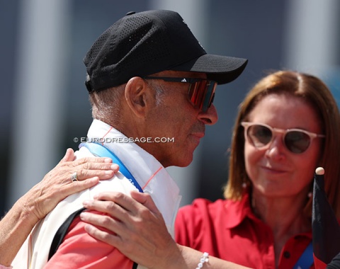 Hands on German co-team trainer Jonny Hilberath's shoulder who was moved to tears