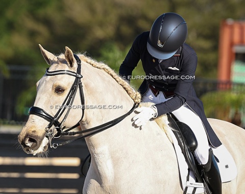 Melissa Brusie pats the American warmblood Atomic Blond