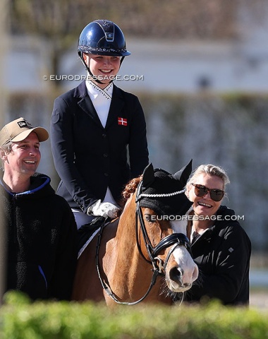 Dennis Fisker, Victoria Bang Zindorff on Del Classico, and Victoria's mom and trainer, Danish GP rider Lone Bang Larsen