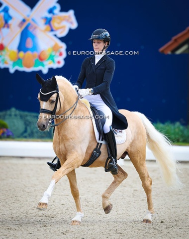 Carina Scholz on the Hong Kong owned, oversized pony Dream Date (by Desert Rose x HET Golden Dream)