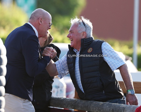 Belgian team captain Jeroen van Lent and Pascal de Winne, father of Belgian Olympic team rider Flore de Winne, celebrate the Nations' Cup win