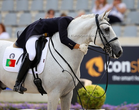Portugal's Joao Torrao hugs his Chinese owned Lusitano Lirio MVL