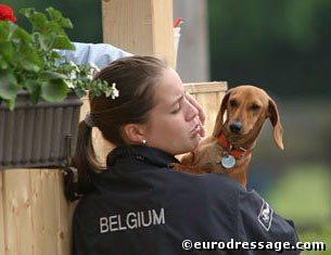 Belgian young rider Julie de Deken with her dachshund Popov