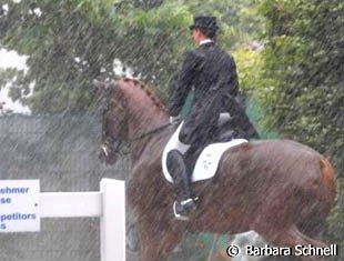 Isabell Werth and Warum Nicht stuck in a torrential down pour. The class was delayed for half an hour :: Photo © Barbara Schnell