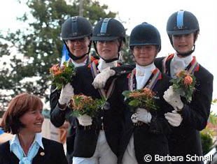 The silver medal winning Dutch team flanked by chef d'equipe Christa Laarakkers