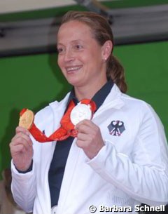 Isabell Werth with her 2008 Olympic medals: team gold, individual silver :: Photo © Barbara Schnell