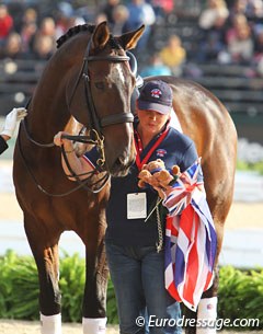 Two Sox is interested in what his groom has in her hands during the Grand Prix team prize giving :: Photo © Astrid Appels