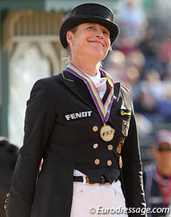 Isabell Werth smiling on the podium while receiving team bronze at the 2010 World Equestrian Games :: Photo © Astrid Appels