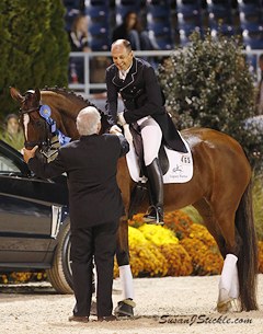 Judge Axel Steiner congratulates the 2013 CDI-W Devon Freestyle winner Lars Petersen on Mariett :: Photo © Sue Stickle