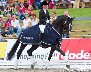 Anja Engelbart and Danciano win the 2014 Hanoverian Young Horse Championship in Verden :: Photo © Christina Beuke