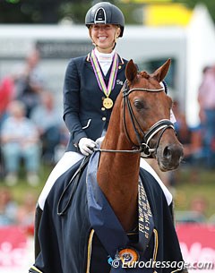 Kirsten Brouwer and Dancer win gold in the 6-year old division at the 2014 World Young Horse Championships :: Photo © Astrid Appels