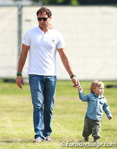 Spanish Grand Prix rider Jordi Domingo taking his son for a stroll