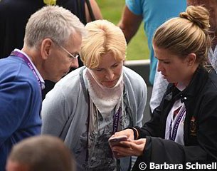 Morgan Barbançon showing Horst Lappe and Nadine Capellmann a video of her riding Nadine's former GP horse Girasol