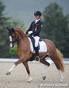Semmieke Rothenberger competing Paso Double in the rain