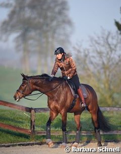 Victoria Michalke walking Novia in the early morning at the 2016 CDI Hagen :: Photo © Barbara Schnell